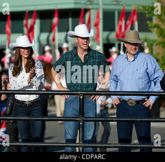 July 7, 2011 - Calgary, Alberta, Canada - Catherine Middleton, Duchess of Cambridge and Prince William arrive at the Calgary Stampede grounds in front of BMO centre with Canadian Prime Minister Stephen Harper, to watch a rodeo demonstration. Calgary is the last Canadian stop of the British Royal Tou Stock Photo