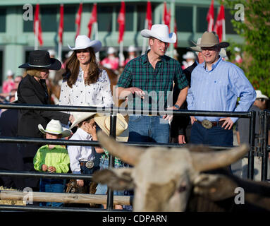 July 7, 2011 - Calgary, Alberta, Canada - Catherine Middleton, Duchess of Cambridge and Prince William arrive at the Calgary Stampede grounds in front of BMO centre with Canadian Prime Minister Stephen Harper, to watch a rodeo demonstration. Calgary is the last Canadian stop of the British Royal Tou Stock Photo