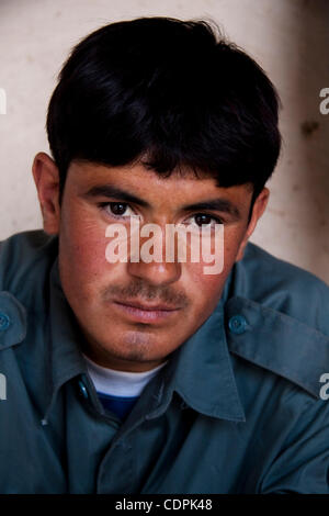 Apr 25, 2011 - Naw Zad, Helmand, Afghanistan - Afghan National Police (ANP) member ABDUL KAREEM, 16, of Ghor province looks at the camera while on duty at the police headquarters in the town of Naw Zad in Naw Zad district in Helmand province, Afghanistan, Monday. His superior, district police chief 