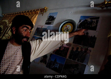 Apr 25, 2011 - Naw Zad, Helmand, Afghanistan - Naw Zad district Afghan National Police Chief ABDULLAH FARIDI, from the village of Surkano in the area points to photos of policemen under his command that were killed on duty during a meeting with correspondents and U.S. Marines  in his office at the p