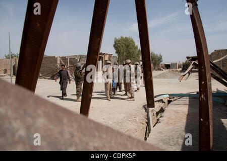 Apr 27, 2011 - Town of Naw Zad, Naw Zad district, Helmand, Afghanistan - Marines of Lima Company, 3rd Battalion of 2nd Marine Regiment pass bent steel girders during a joint patrol with ANA soldiers from 4th Company, 3rd Kandak, 2nd Brigade of 215th Afghan National Army Corps in the Bazar of Naw Zad Stock Photo