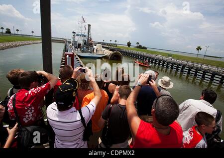Jul 10, 2011 - Cape Canaveral, Florida, U.S. - MV Liberty Star sits in Canaveral Lock with the first of space shuttle Atlantis's two solid rocket boosters as onlookers take pictures (Credit Image: © Joel Kowsky/ZUMApress.com) Stock Photo