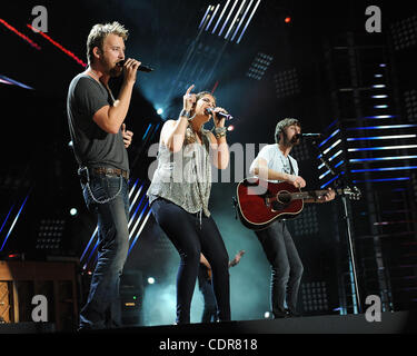 Jun 10, 2011 - Nashville, Tennessee; USA -  Singers CHARLES KELLEY, HILLARY SCOTT and Guitarist DAVE HAYWOOD of the band Lady Antebellum performs live at LP Field as part of the 40th Anniversary of the CMA Music Festival that is taking place over a four day period in downtown Nashville.  Copyright 2 Stock Photo