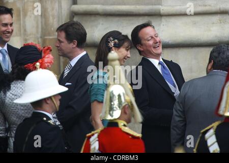 April 29, 2011 - London, England, UK - All leaders of the 3 largest UK political parties, (R-L) Prime Minister David Cameron and wife Samantha, Nick Clegg and wife Miriam, and Ed Miliband and partner Justine Thornton, share a laugh upon exiting Westminster Abbey at the conclusion of Prince William a Stock Photo