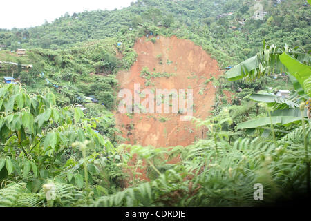 Apr 23, 2011 - Pantukan, Compostella Valley, Philippines - The scene of a landslide site where rescuers search for people missing Saturday after an avalanche of mud buried an illegal gold mining camp on Friday, April 22, 2011 in the town of Pantukan in Compostella Valley in the southern Philippines. Stock Photo