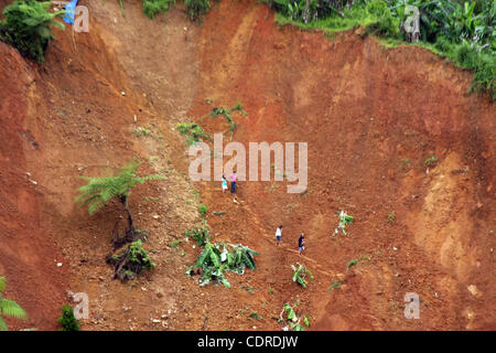 Apr 23, 2011 - Pantukan, Compostella Valley, Philippines - A scene of landslide Saturday after an avalanche of mud buried an illegal gold mining camp on Friday, April 22, 2011 in the town of Pantukan in Compostella Valley in the southern Philippines. Officials say at least three bodies have been rec Stock Photo