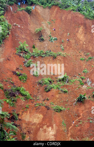 Apr 23, 2011 - Pantukan, Compostella Valley, Philippines - A scene of landslide Saturday after an avalanche of mud buried an illegal gold mining camp on Friday, April 22, 2011 in the town of Pantukan in Compostella Valley in the southern Philippines. Officials say at least three bodies have been rec Stock Photo