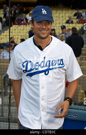 Apr. 20, 2011 - Los Angeles, California, United States of America - Actor Josh Duhamel has some fun with fans, as he practices his phrase, ''It's time for Dodger Baseball'' to be said just prior to the start of the game between the Atlanta Braves and the Los Angeles Dodgers at Dodger Stadium. (Credi Stock Photo