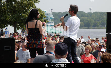 June 04, 2011 - Le Claire, Iowa, U.S. - DANIELLE COLBY CUSHMAN, left and MIKE WOLFE, two of the three stars on The History Channel's 'American Pickers,' answer questions from the audience during the 'American Pickers' Weekend that brought an estimated 10,000 people to town. Co-star F. Fritz did not  Stock Photo