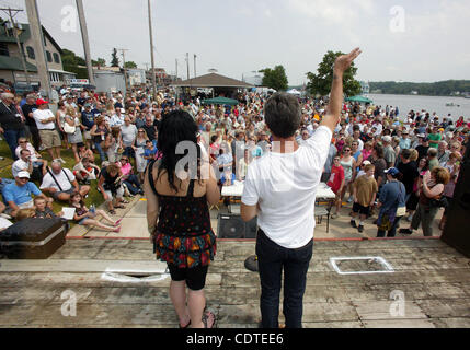 June 4, 2011 - Le Claire, Iowa, U.S. - DANIELLE COLBY CUSHMAN, left and MIKE WOLFE, two of the three stars on The History Channel's 'American Pickers,' answer questions from the audience during the 'American Pickers' Weekend that brought an estimated 10,000 people to town. Co-star F. Fritz did not a Stock Photo