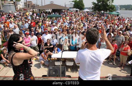 Danielle Colby Cushman, left and Mike Wolfe, two of the three stars on The History Channel's 'American Pickers,' answer questions from the audience Saturday June 4, 2011 during the 'American Pickers' Weekend that brought an estimated 10,000 people to LeClaire, Iowa. Co-star Frank Fritz did not atten Stock Photo