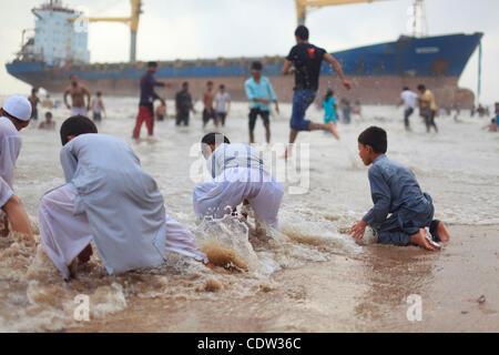 June 26, 2011 - Mumbai, India - An unusual sight greeted the monsoon revellers at the Juhu Chowpatty beach as the MV Wisdom, a merchant ship, has been grounded since June 11 after it broke loose from the towing tug and drifted ashore while it was being towed away to Alang shipyard to be broken down  Stock Photo