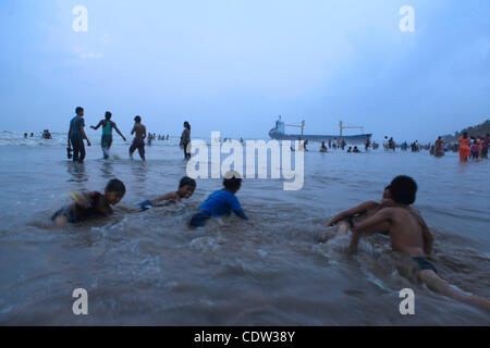 An unusual sight greeted the monsoon Revellers at the Juhu Chowpatty beach in Mumbai,India as the MV Wisdom,a merchant ship has been grounded since June 11 after it broke loose from the towing tug and it drifted ashore while it was being towed away to Alang shipyard to be broken down as scrap. Techn Stock Photo