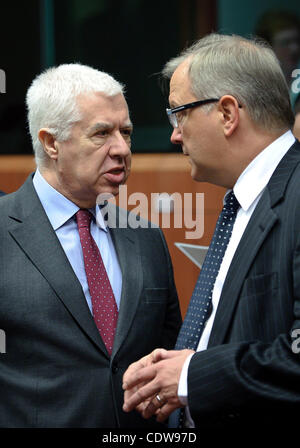 May 16, 2011 - Brussels, BXL, Belgium - Portugal's Finance Minister Fernando Teixeira dos Santos listens to European Economic and Monetary Affairs Commissioner Olli Rehn (R)  prior to a ministerial meeting on the European Stability Mechanis and Eurogroup meeting in  Brussels, Belgium on 2011-05-16 E Stock Photo