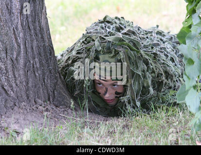 Russian teenagers are getting military skills during the summer training camp Zarnitsa for teenages organized by military-patriotic club.The event is taking place at the military base of 27th Rifle-infantry division near Moscow. Pictured: Russian teenager during military training. Stock Photo