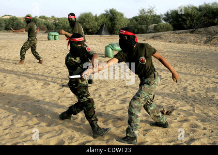 Militants of the Democratic Front for Liberation Palestine (DFLP) train during a military graduation ceremony in Rafah, southern Gaza Strip, on July 29, 2011. Photo by Abed Rahim Khatib Stock Photo