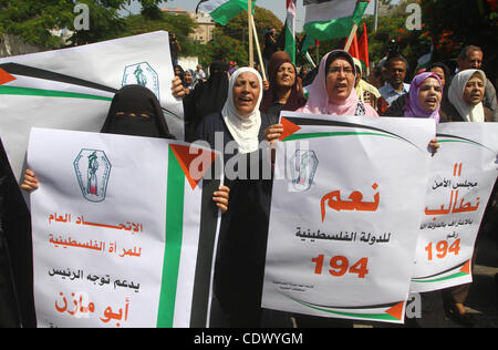 Palestinian women chant slogans and wave their national flag during a demonstration in support of Palestinian leader Mahmud Abbas' bid for statehood recognition at the United Nations on September 22, 2011 in Gaza City. Photo by Ashraf Amra Stock Photo