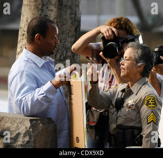 Sept 8,2011- Los Angeles, California, USA.  Michael Jackson activist  Najee Ali(L) holds his sign as jury selection begins Thursday in the involuntary manslaughter trial against Michael Jackson's physician, Dr. Conrad Murray..A request by Murray's attorneys to delay the trial was recently denied, an Stock Photo