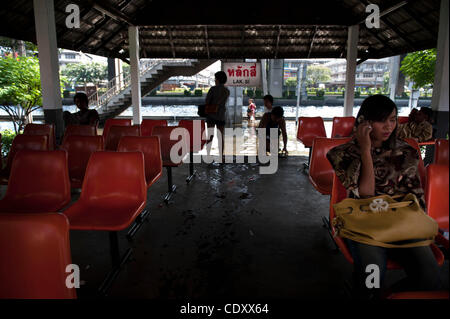 Nov. 3, 2011 - Bangkok, Bangkok, Thailand - Passengers at the Lak Si train station wait for the train..The train used mainly  by people who have been displaced by floods as the one of the few options to commute to central Bangkok..Thailand is experiencing its worst floods in 50 years more than nine  Stock Photo