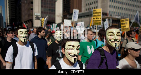 Chicago, IL - Protesters wearing Guy Fawkes masks march down Michigan Avenue in Chicago, IL to mark the 10th anniversary of US and NATO involvement in Afghanistan on October 8, 2011.  Members of the Occupy Chicago movement also participated in the march.  (Credit Image © Joel Kowsky/ZUMAPRESS.com)