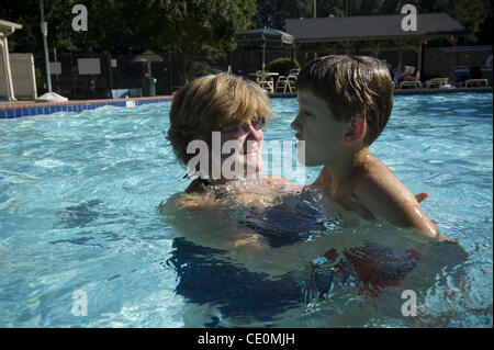 Aug. 27, 2011 - Marietta, GA - Jennifer Schwenker with son Ben, 8 in a community swimming pool. Ben and twin brother Sam are both autistic with limited verbal skills. (Credit Image: © Robin Nelson/ZUMAPRESS.com) Stock Photo
