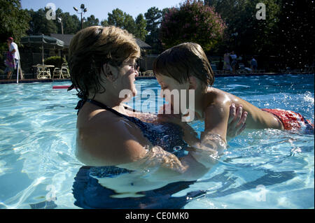 Aug. 27, 2011 - Marietta, GA - Jennifer Schwenker with son Ben, 8 in a community swimming pool. Ben and twin brother Sam are both autistic with limited verbal skills. (Credit Image: © Robin Nelson/ZUMAPRESS.com) Stock Photo