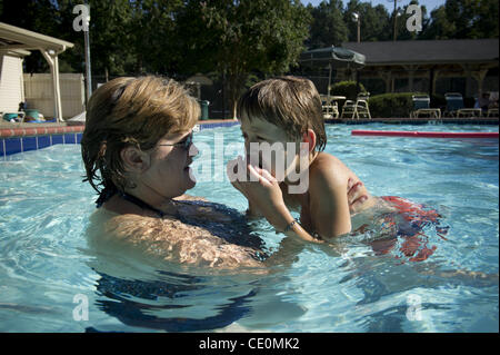 Aug. 27, 2011 - Marietta, GA - Jennifer Schwenker with son Ben, 8 in a community swimming pool. Ben and twin brother Sam are both autistic with limited verbal skills. (Credit Image: © Robin Nelson/ZUMAPRESS.com) Stock Photo