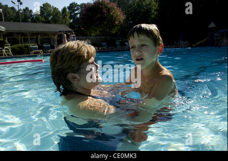 Aug. 27, 2011 - Marietta, GA - Jennifer Schwenker with son Ben, 8 in a community swimming pool. Ben and twin brother Sam are both autistic with limited verbal skills. (Credit Image: © Robin Nelson/ZUMAPRESS.com) Stock Photo