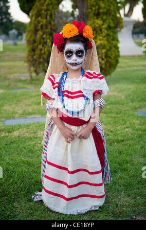 Oct. 22, 2011 - Hollywood, California, U.S. - A young girl dressed traditionally with skull makeup, during the 12th annual Day of The Dead (Dia de Los Muertos) held on the grounds of the historic Hollywood Forever cemetery Los Angeles. Day of the Dead is a Mexican holiday celebrated throughout Mexic Stock Photo