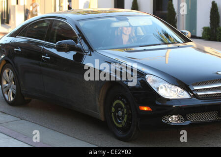 Ali Larter departs in her car, using a spare tire, after shopping in Beverly Hills Los Angeles, California - 09.02.11 Stock Photo