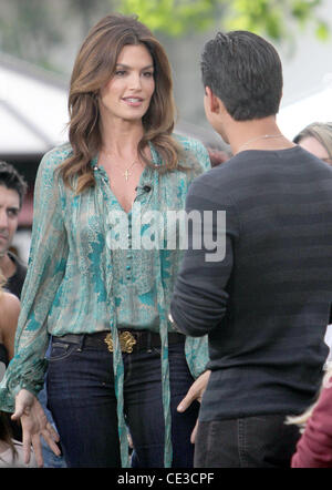 Cindy Crawford  makes an appearance on the entertainment TV show 'Extra' with host Mario Lopez at the Grove  Los Angeles, California - 25.10.10 Stock Photo