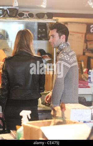Adam Levine and his girlfriend Victoria's Secret model, Anne Vyalitsyna, shop for sunglasses at Optical in Hollywood. Los Angeles, California - 21.12.10 Stock Photo