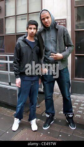 J. Cole aka Jermaine Lamarr Cole American rapper posing with a fan as he leaves BBC Radio 1 studios London, England - 07.01.11 Stock Photo