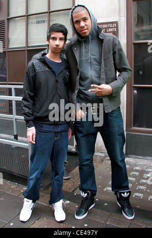 J. Cole aka Jermaine Lamarr Cole American rapper posing with a fan as he leaves BBC Radio 1 studios London, England - 07.01.11 Stock Photo