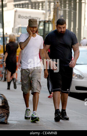 Swizz Beatz aka Kasseem Dean talking on his cell phone while walking to his gym in Manhattan New York City, USA - 08.09.10 Stock Photo