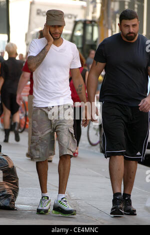 Swizz Beatz aka Kasseem Dean talking on his cell phone while walking to his gym in Manhattan New York City, USA - 08.09.10 Stock Photo