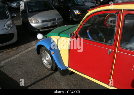 colourful citroen 2cv car in street road in rome italy Stock Photo