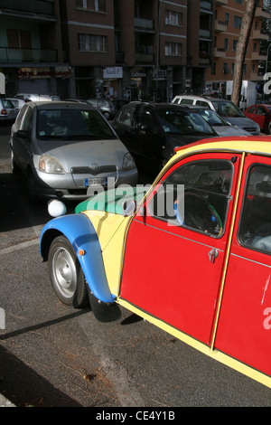 colourful citroen 2cv car in street road in rome italy Stock Photo