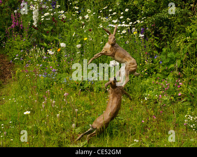 Two Hares Sculpture in a Meadow Stock Photo