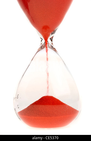 Hourglass with red sand running through Stock Photo - Alamy