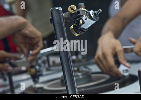 worker with dops polishing and inspecting diamond  Borivali Mumbai India Stock Photo