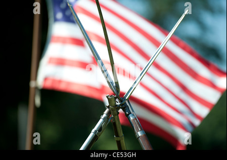 Bayonets criss-crossed in front of American flag for Civil War reenactment at encampment in Union Mills MD Stock Photo