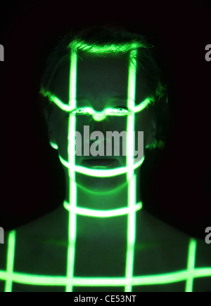 Biometric, symbol photo. Automatic face detection, by a laser scanner. 3D-model of a female face for generating digital data. Stock Photo