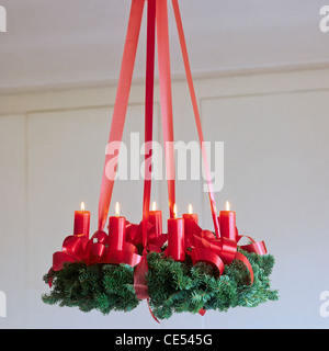 Christmas Advent wreath with red candles hanging from ceiling  Alsace  France, Europe Stock Photo