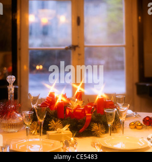 Candlelit Christmas dinner table, window,  Alsace  France, Europe Stock Photo