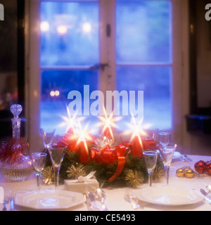 Candlelit Christmas dinner table, window,  Alsace  France, Europe Stock Photo
