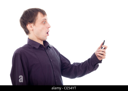 Funny surprised nerd man looking at cellphone, isolated on white background. Stock Photo