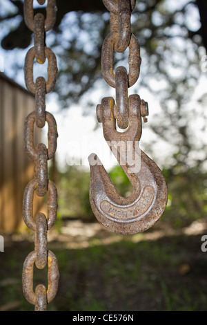 Rusty heavy duty chain with hook attached Stock Photo