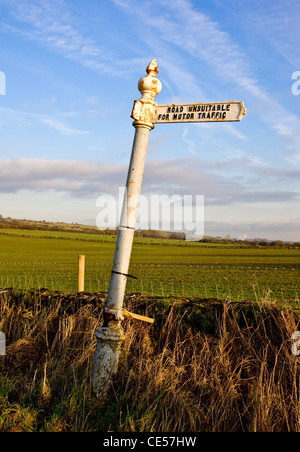 Road unsuitable for motor traffic - a battered old road sign near Cheddar in the Somerset Mendips UK Stock Photo