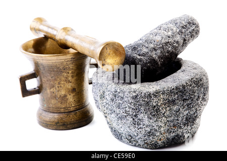 Granite and brass mortar with pestles on a white background Stock Photo